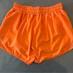 Lululemon athletica women's bright orange hotty hot shorts 4 inch, size 2